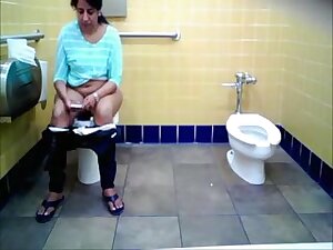 Desi Nri Aunty Caught Pissing In Toilet